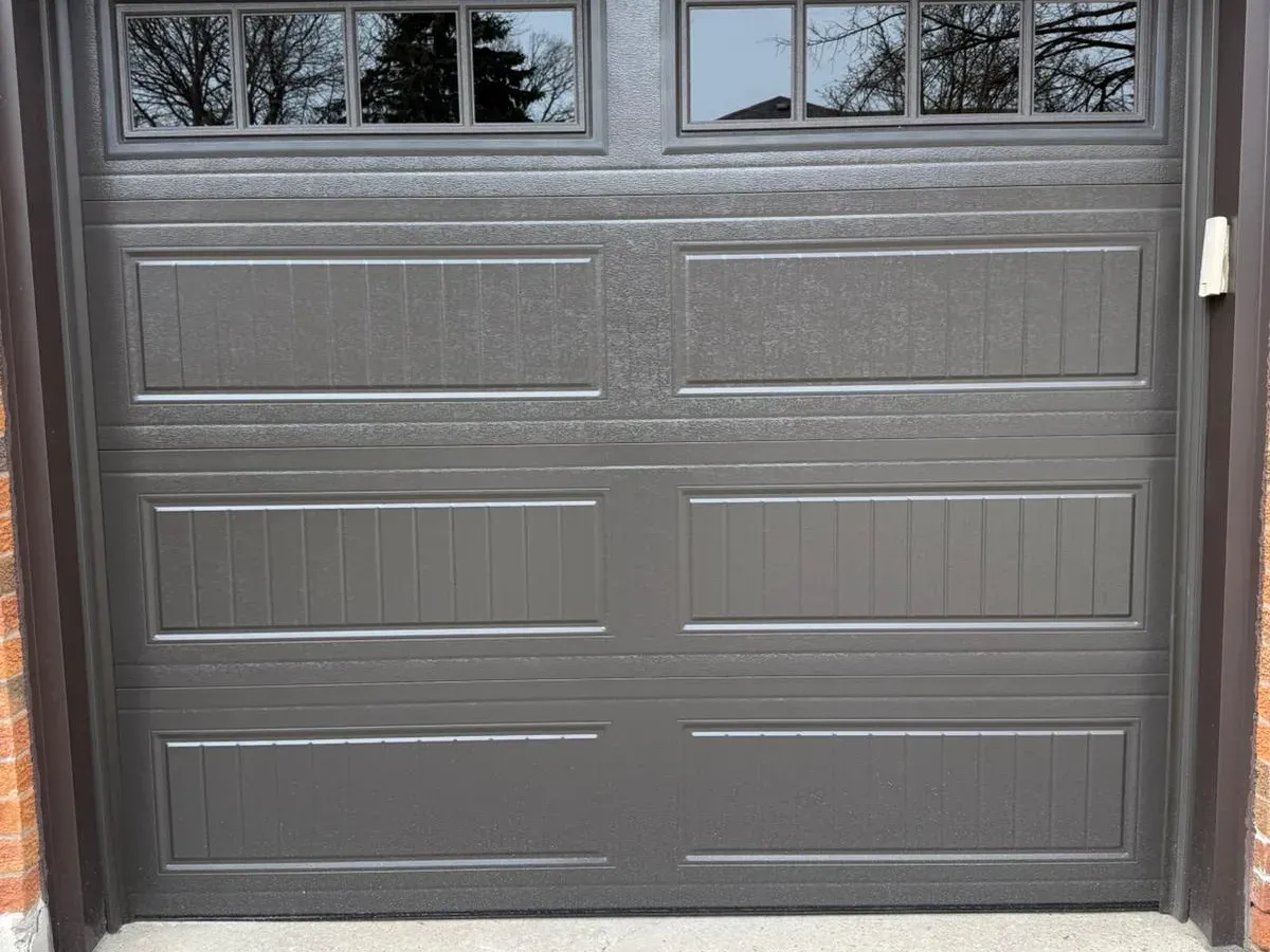 Brown carriage-style garage door installation