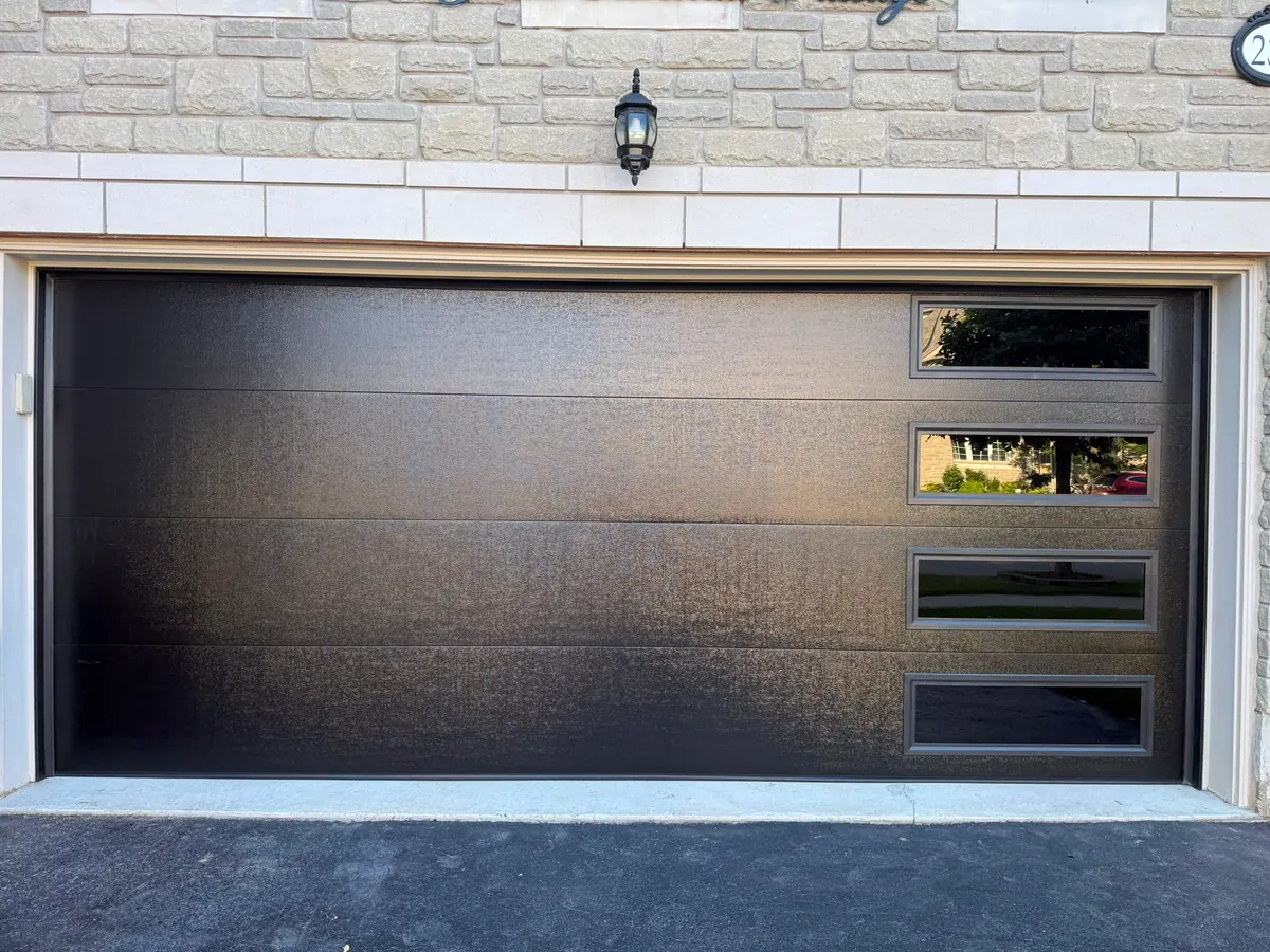 Dark brown modern flush-panel double garage door with side windows