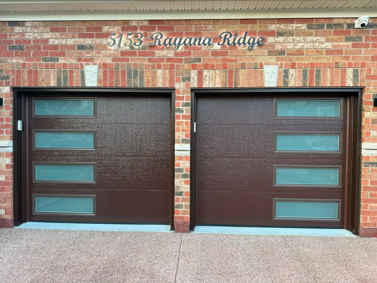 Dark brown modern flush-panel garage doors with frosted side windows