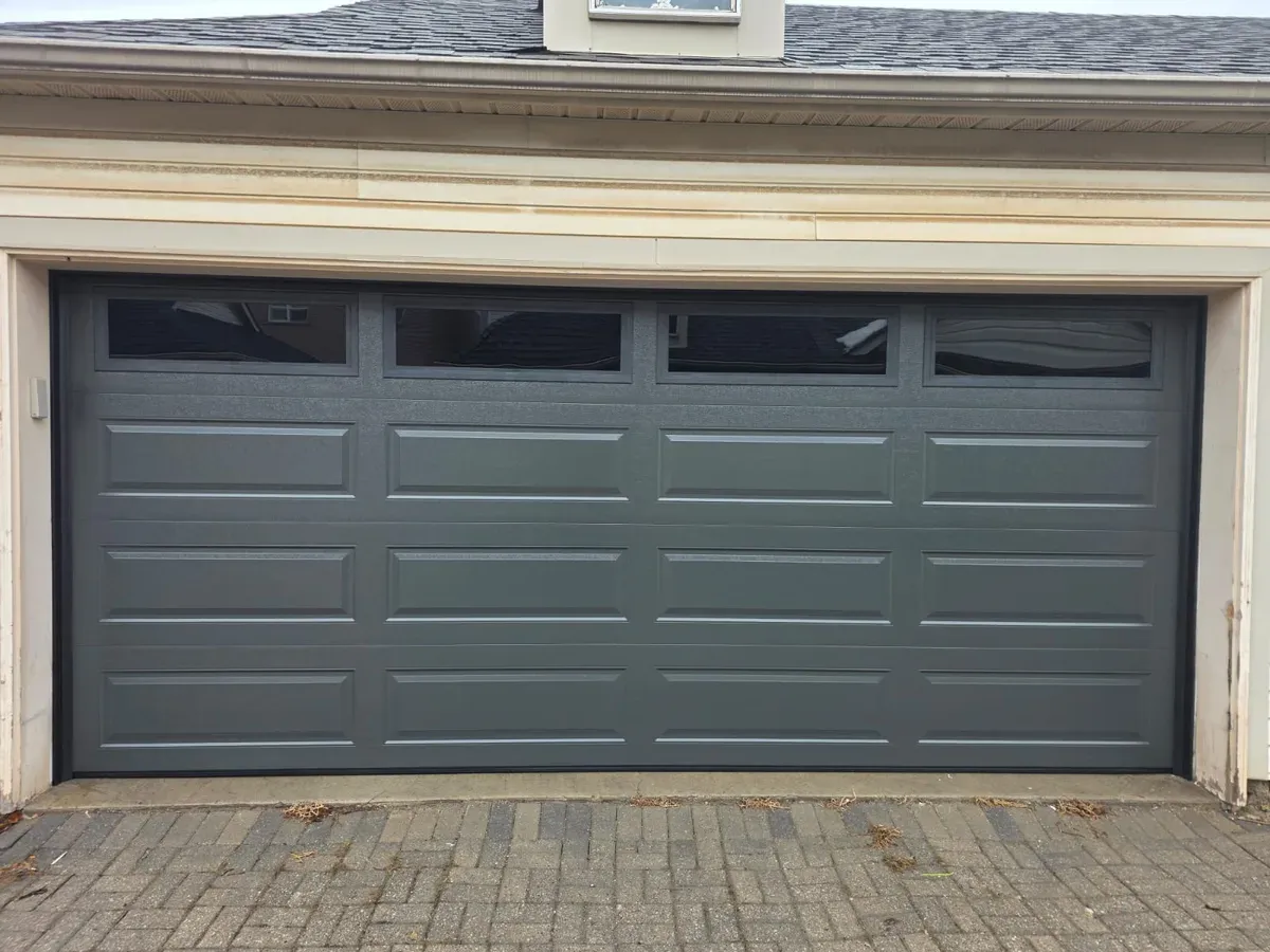 Dark grey double door with top window row