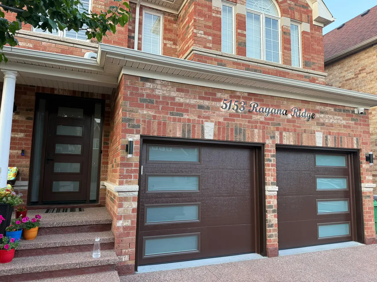 Espresso modern flush-panel garage door — full exterior view