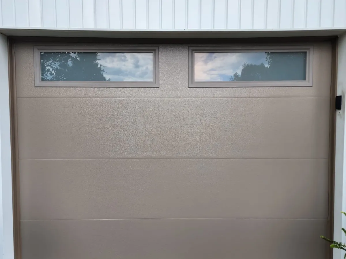 Champagne single garage door with top windows