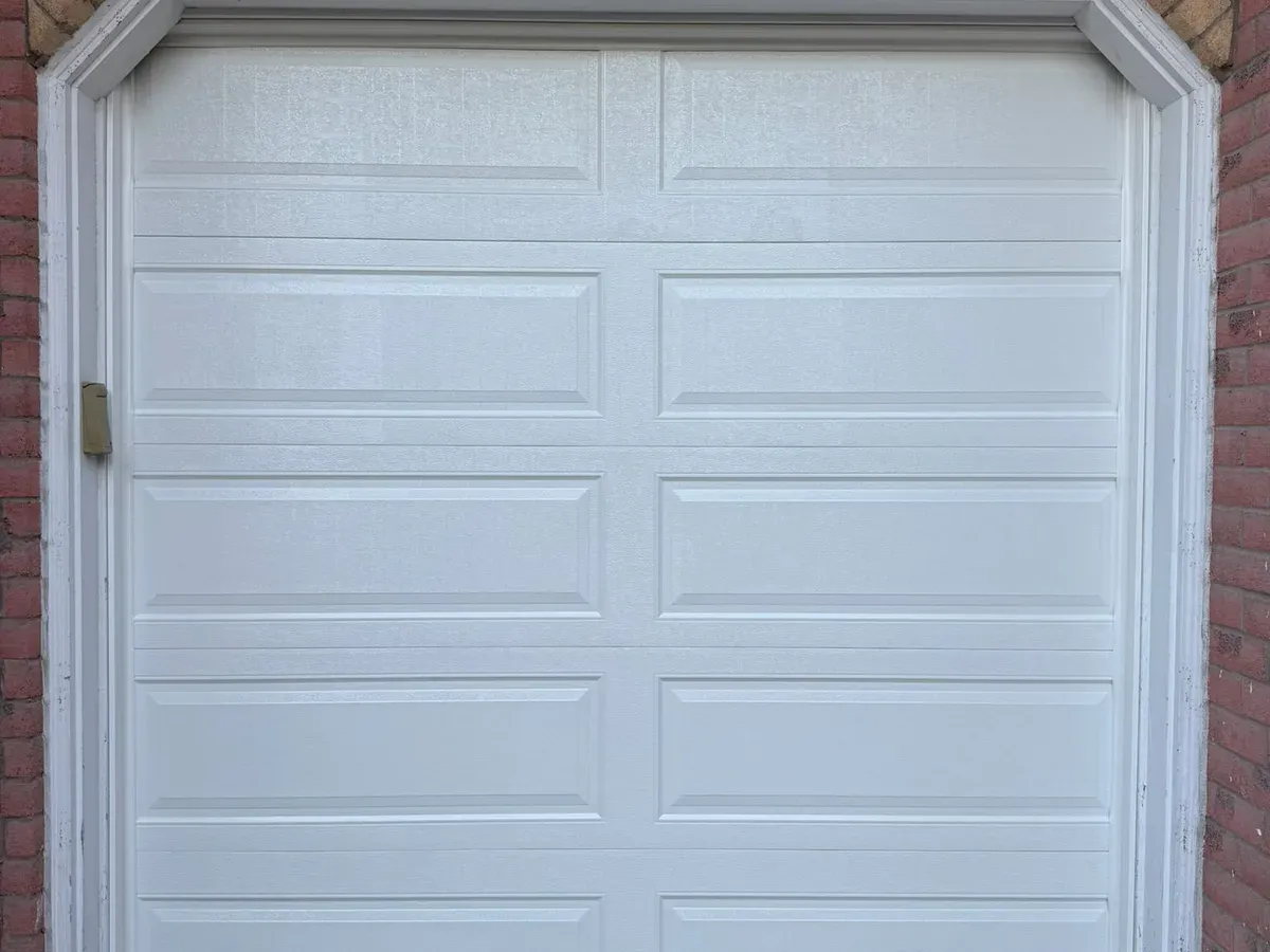 Grey sectional door with glass inserts